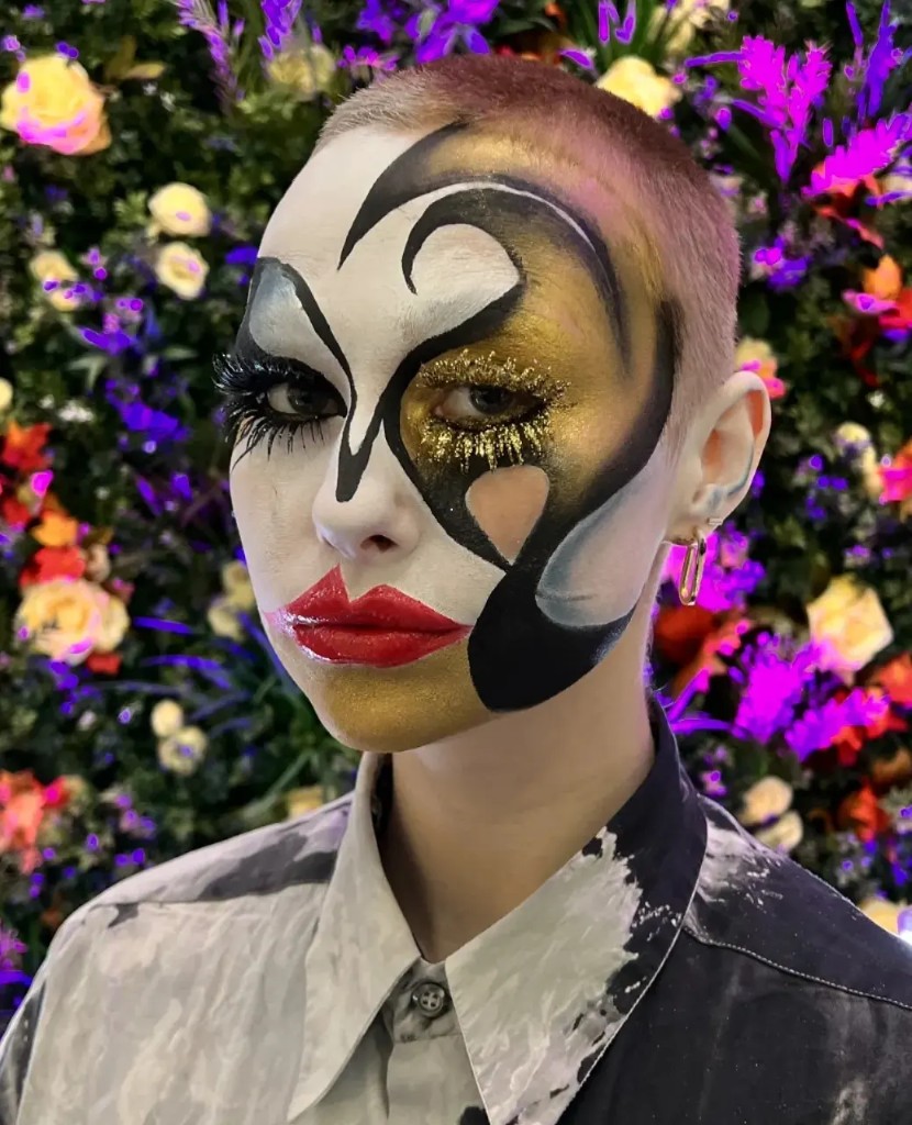 Black, white and gold graphic face paint