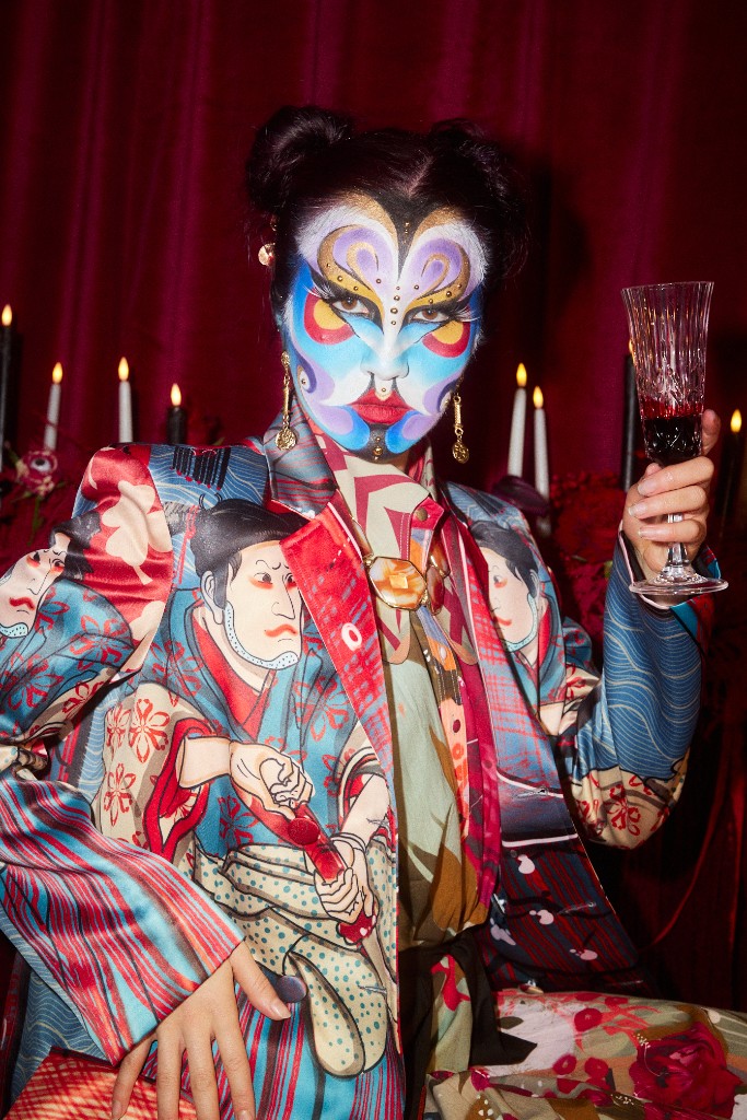 Kabuki-inspired face paint with a patterned jacket