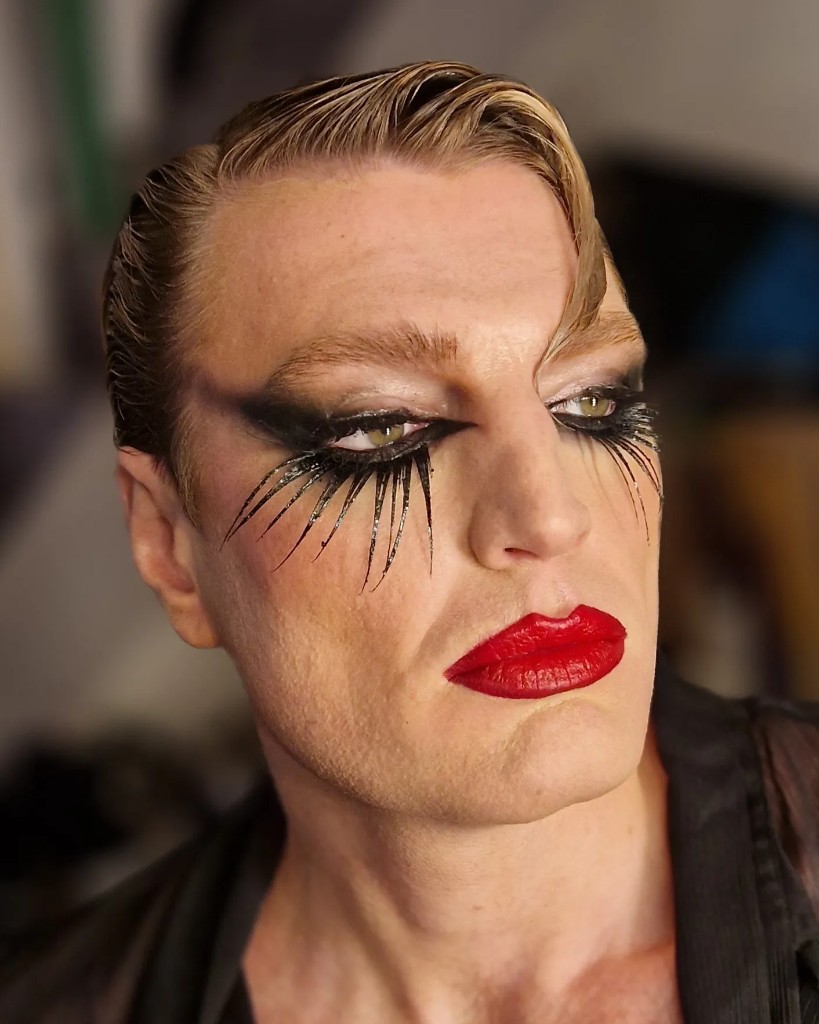 Extended lashes and a saturated red lip